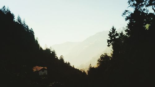 Scenic view of silhouette mountains against clear sky