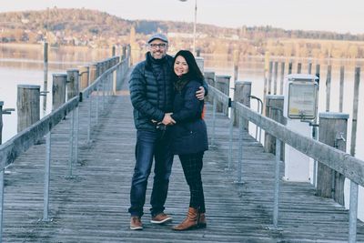 Full length of couple standing on pier