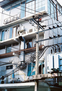 Low angle view of cables in city