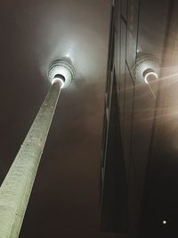 Low angle view of illuminated light against building