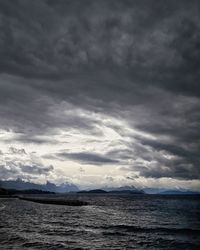 Scenic view of sea against sky at dusk