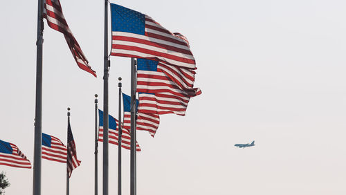 Low angle view of flag against clear sky