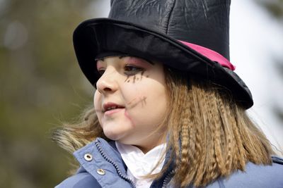 Close-up of girl wearing hat