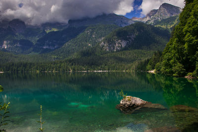 Scenic view of lake and mountains against sky