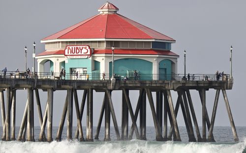 Pier over sea against clear sky