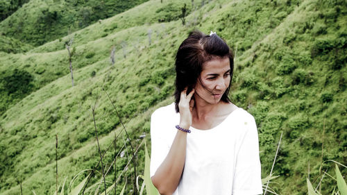 Young woman standing on field