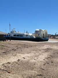 Train on land against clear blue sky