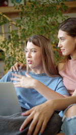 Young woman using laptop