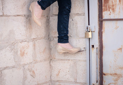 Low section of woman standing on floor