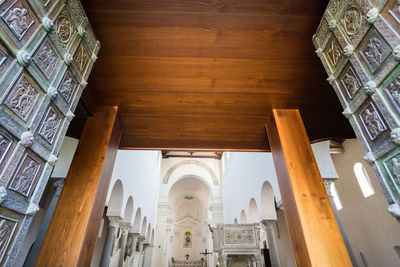 Low angle view of historic building seen through ceiling