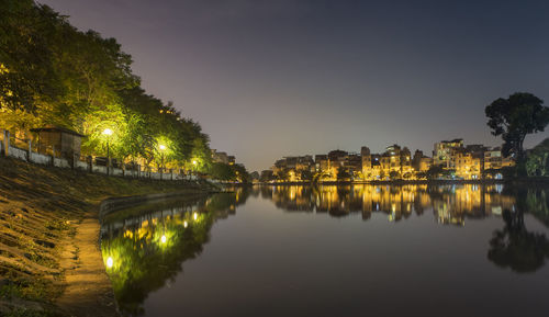 Reflection of trees in water at night