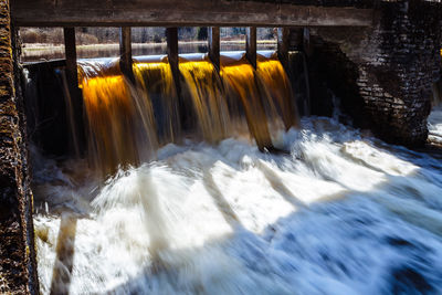Blurred motion of dam against river