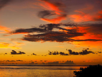 Scenic view of sea against orange sky