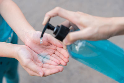 Midsection of people working in swimming pool
