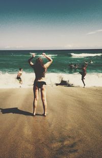 Woman standing on beach