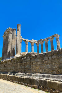 Low angle view of historical building against blue sky