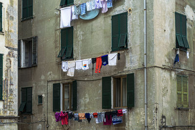 Low angle view of clothes drying outside building