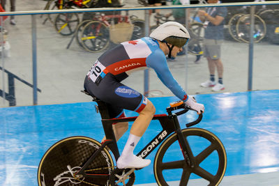 Side view of man riding bicycle