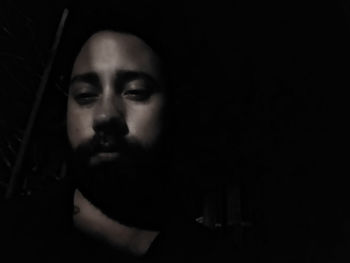 Portrait of young woman in darkroom