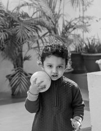 Portrait of cute boy with ball