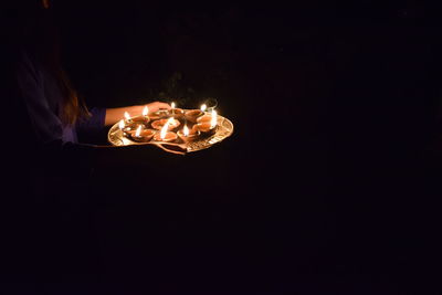 Illuminated lighting equipment against black background