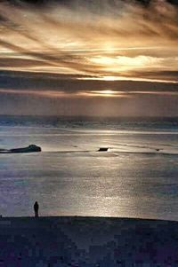 Scenic view of sea at sunset