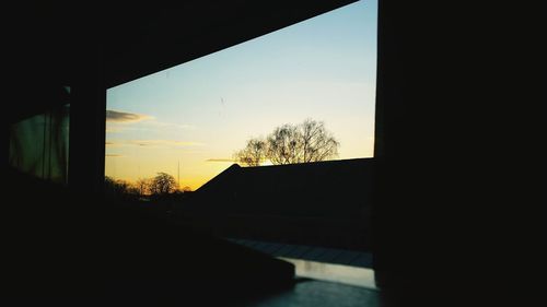 Built structure against sky at sunset