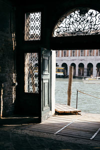 Grand canal by buildings seen through door