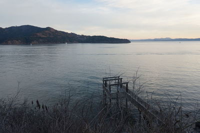 Scenic view of sea against cloudy sky