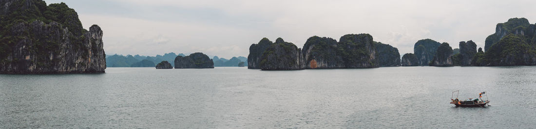 Panoramic view of halong bay and mountains against sky