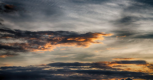 Low angle view of dramatic sky during sunset
