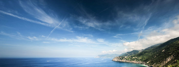 Scenic view of ocean against cloudy sky