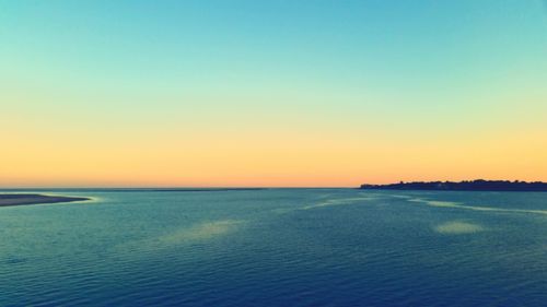 Scenic view of sea at sunset