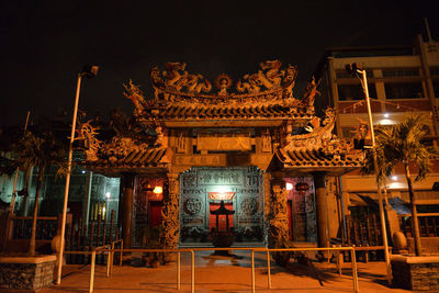 Illuminated historic building against sky at night