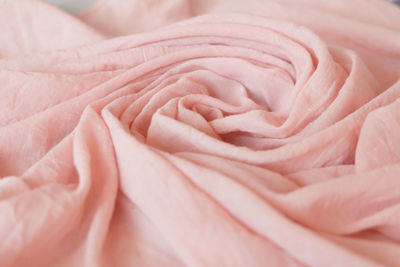 Light pink cloth. soft muslin blanket. cotton clothing and textiles.  fabrics texture. close up.