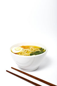 Close-up of soup in bowl against white background