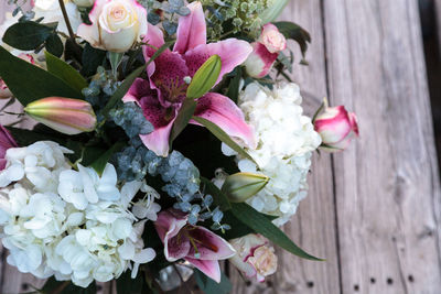 High angle view of bouquet on wooden table