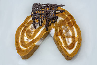 High angle view of bread on white table