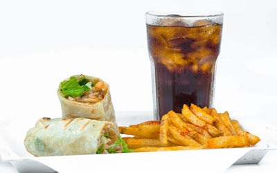 Close-up of food on table against white background