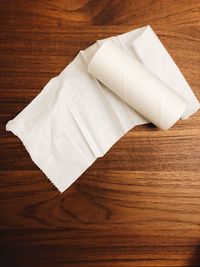 High angle view of white umbrella on wooden floor