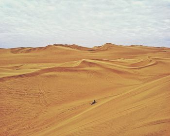 Scenic view of desert against sky