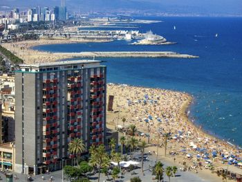 High angle view of cityscape by sea