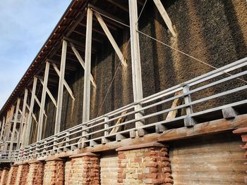 Low angle view of bridge against building