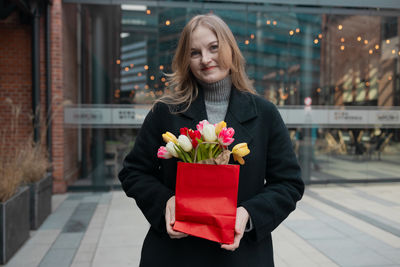 Young woman holding gift