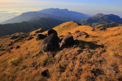 Scenic view of landscape and mountains against sky