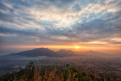 Scenic view of landscape against sky during sunset