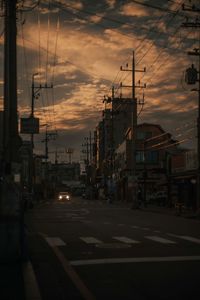 View of city street at sunset