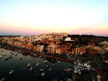 High angle view of buildings against sky during sunset