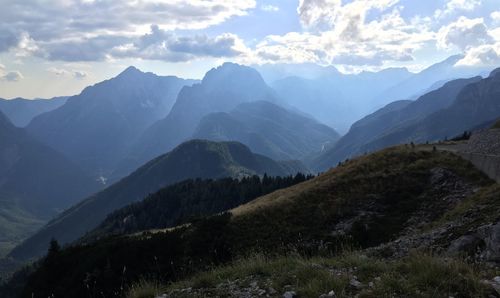 Scenic view of mountains against cloudy sky