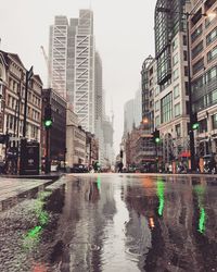 Reflection of buildings in puddle